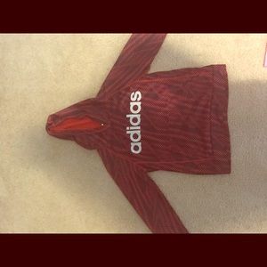 This is a red adidas sweatshirt